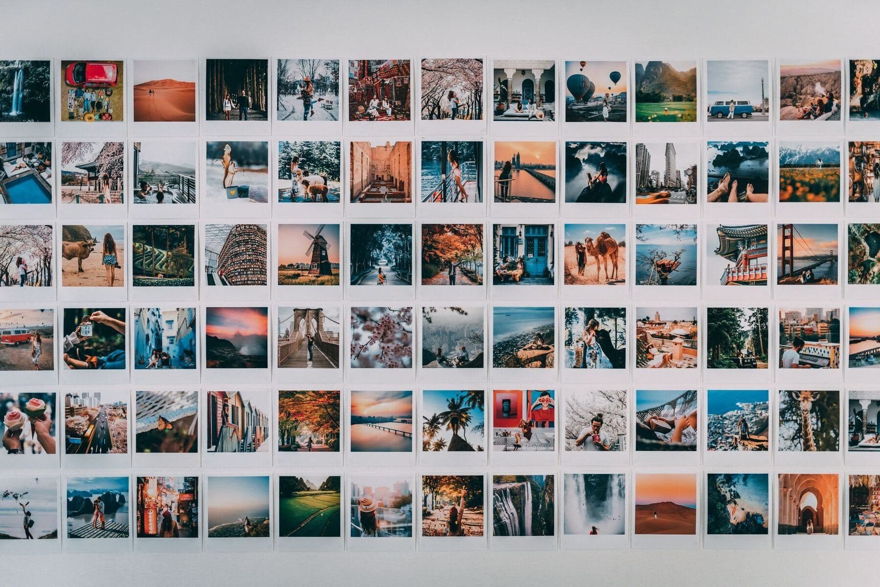 Grid of photographs laid out on a table