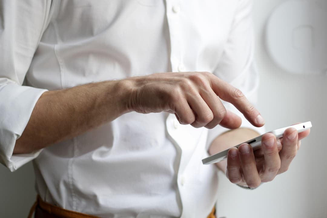 Typing a search phrase into a phone, the query a pin has to match