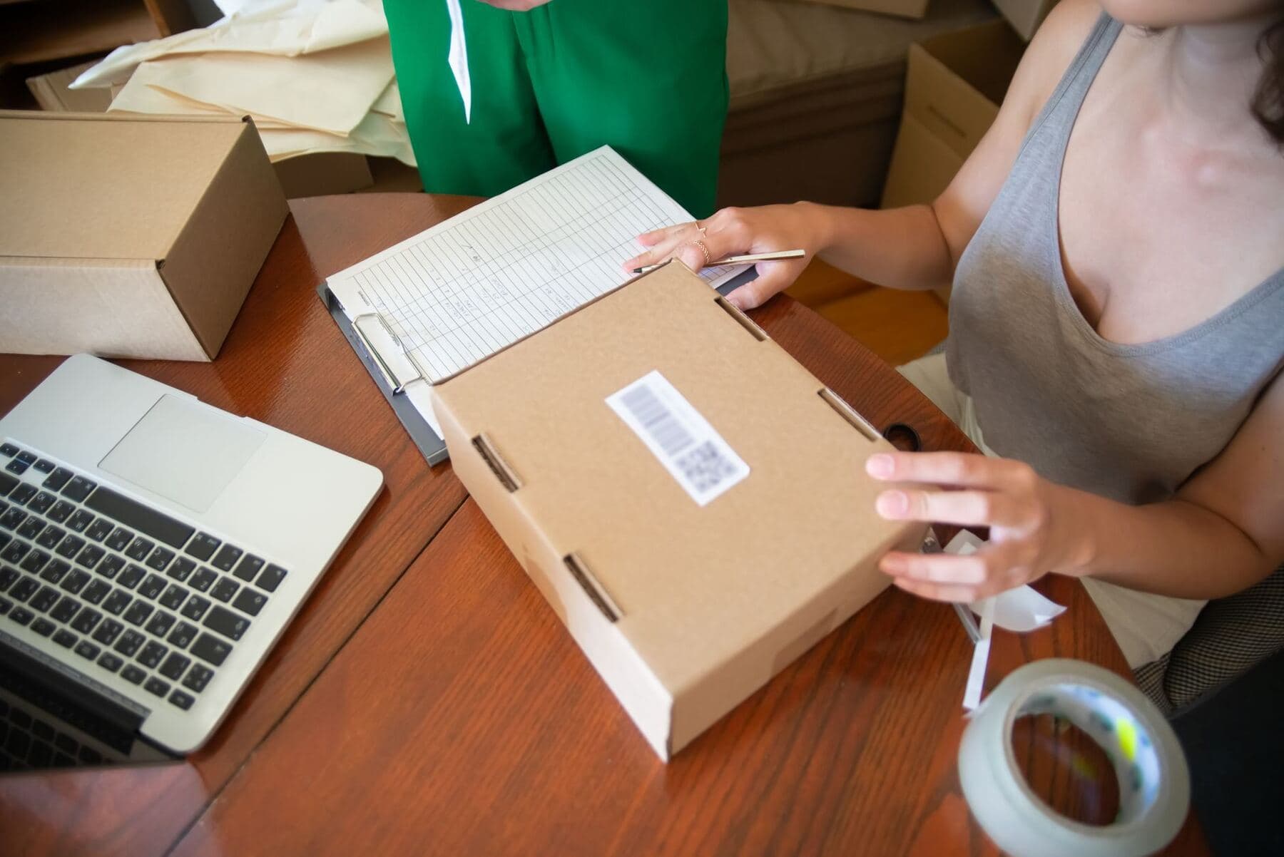 Small business owner packing an order