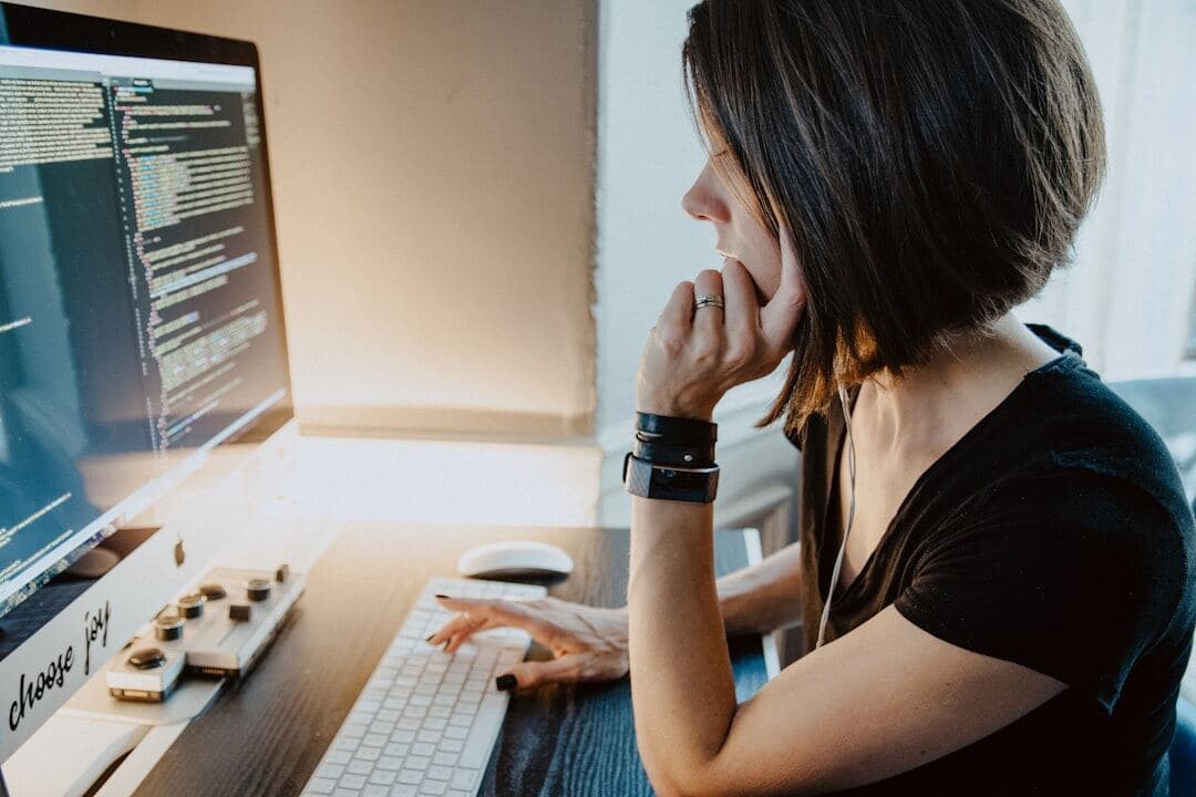Woman working on her blog at a desk