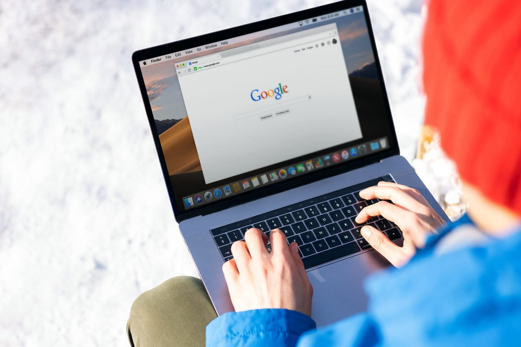 Person searching on a laptop