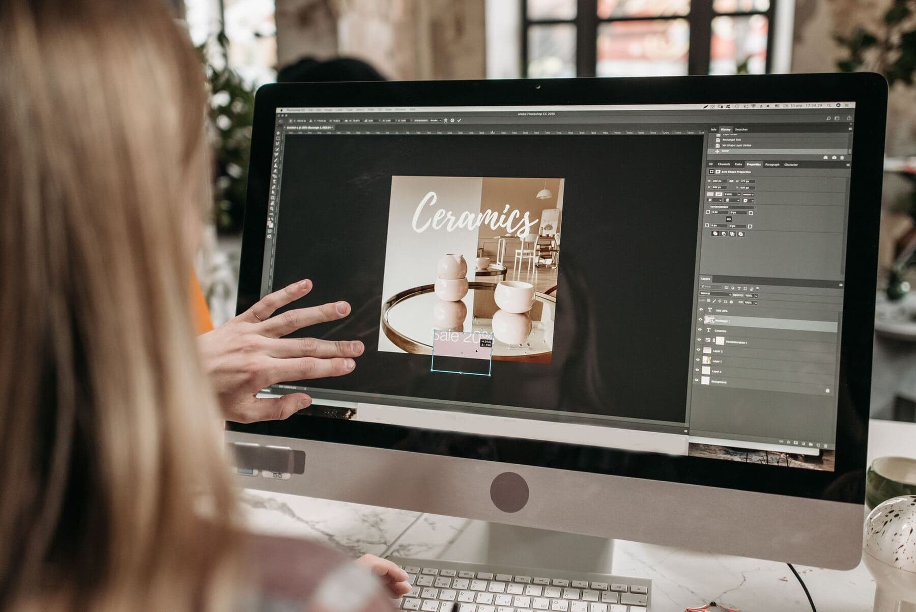 Graphic designer working on a pin layout
