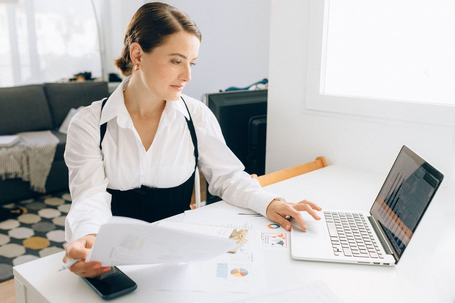 Analyst reviewing data on a laptop