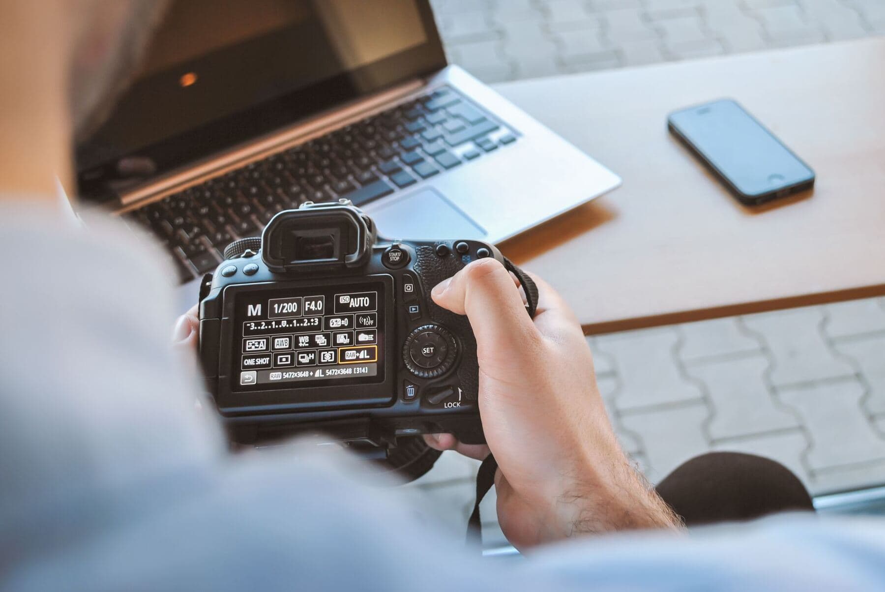 Person editing photo settings on a phone