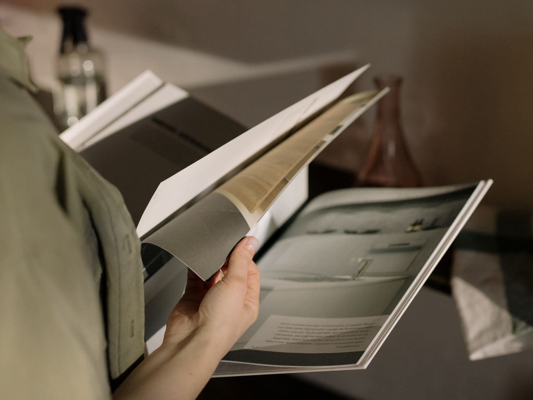 Person browsing a magazine