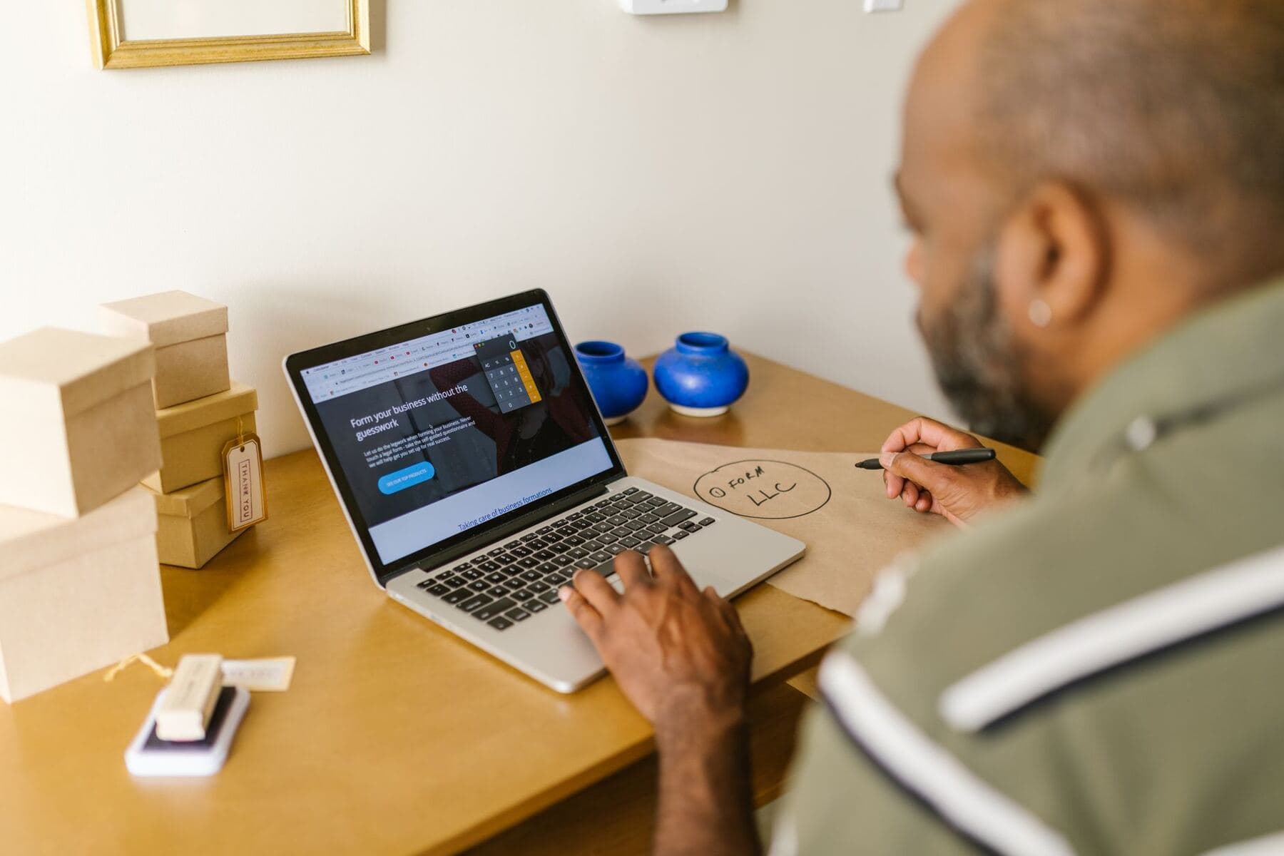 Small business owner working at a laptop