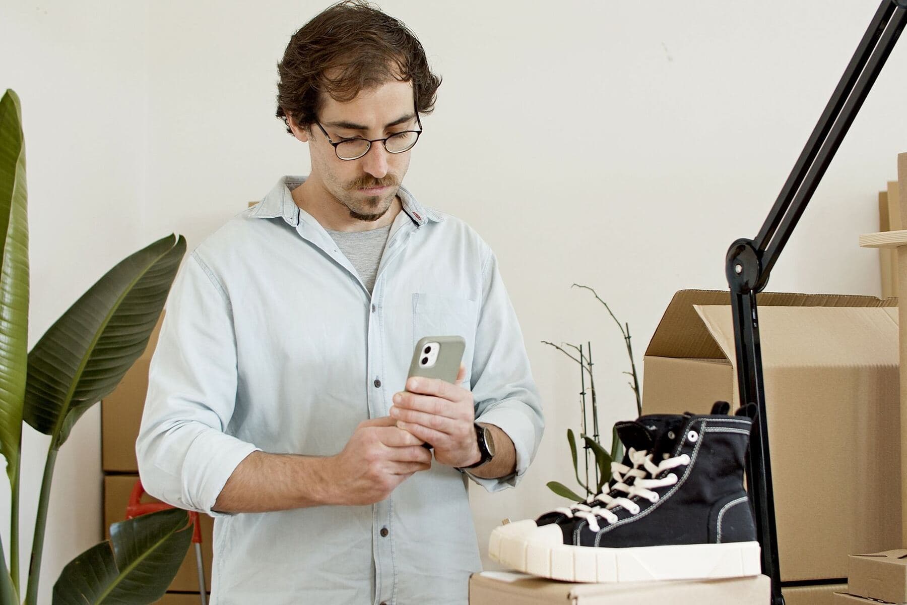Shop owner reviewing product photographs