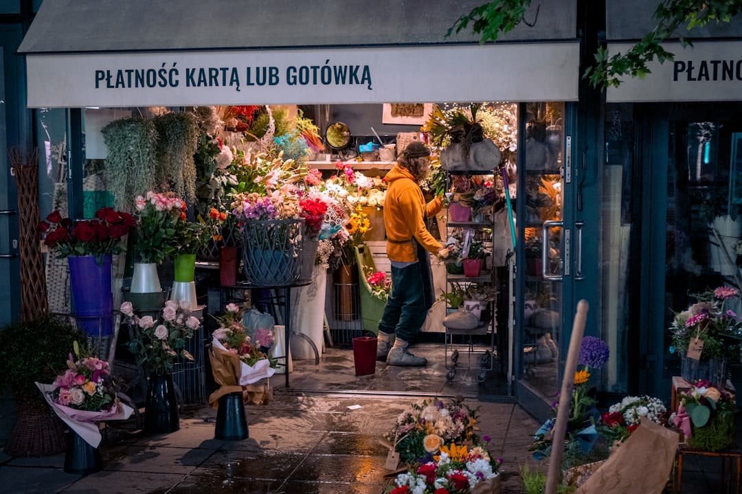 A florist arranging flowers, a considered visual purchase that fits Pinterest