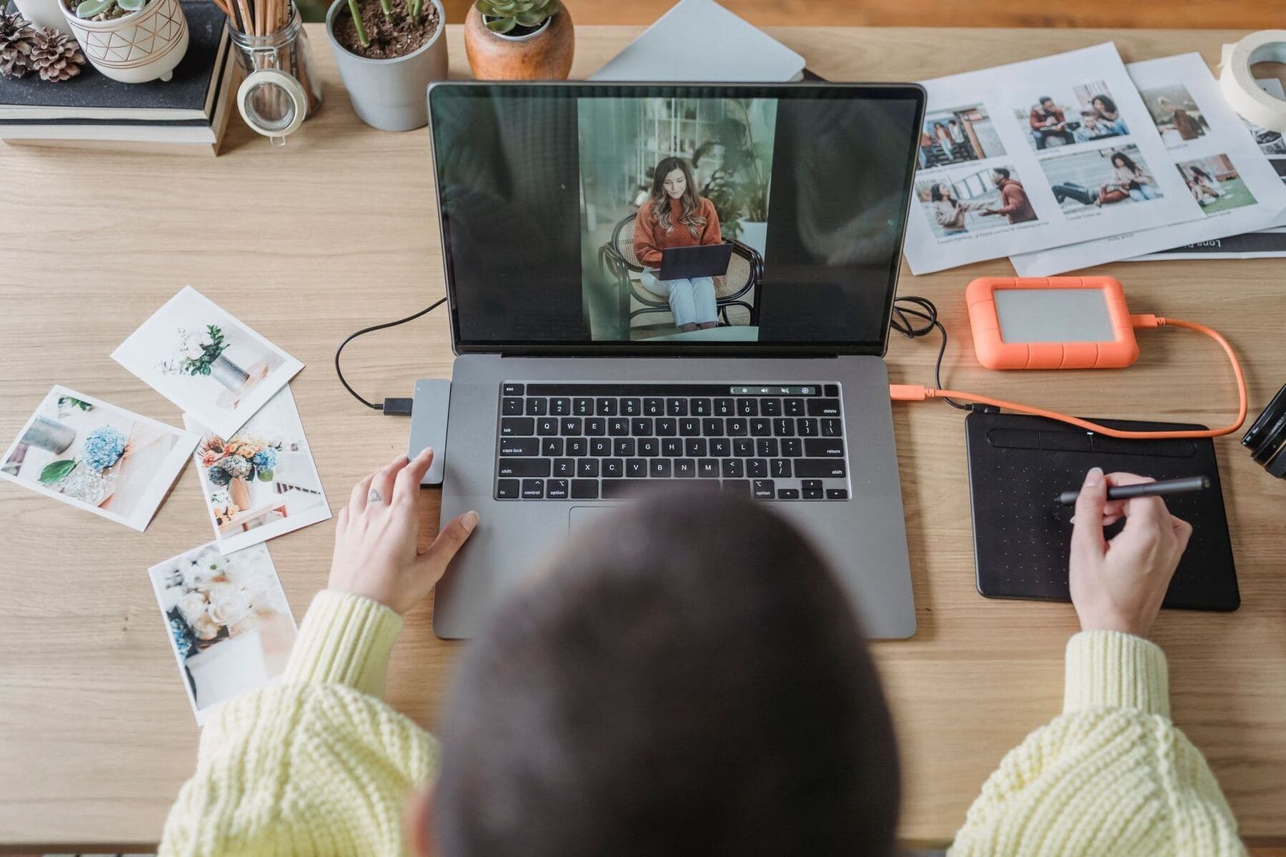 Photographer editing photos on a laptop