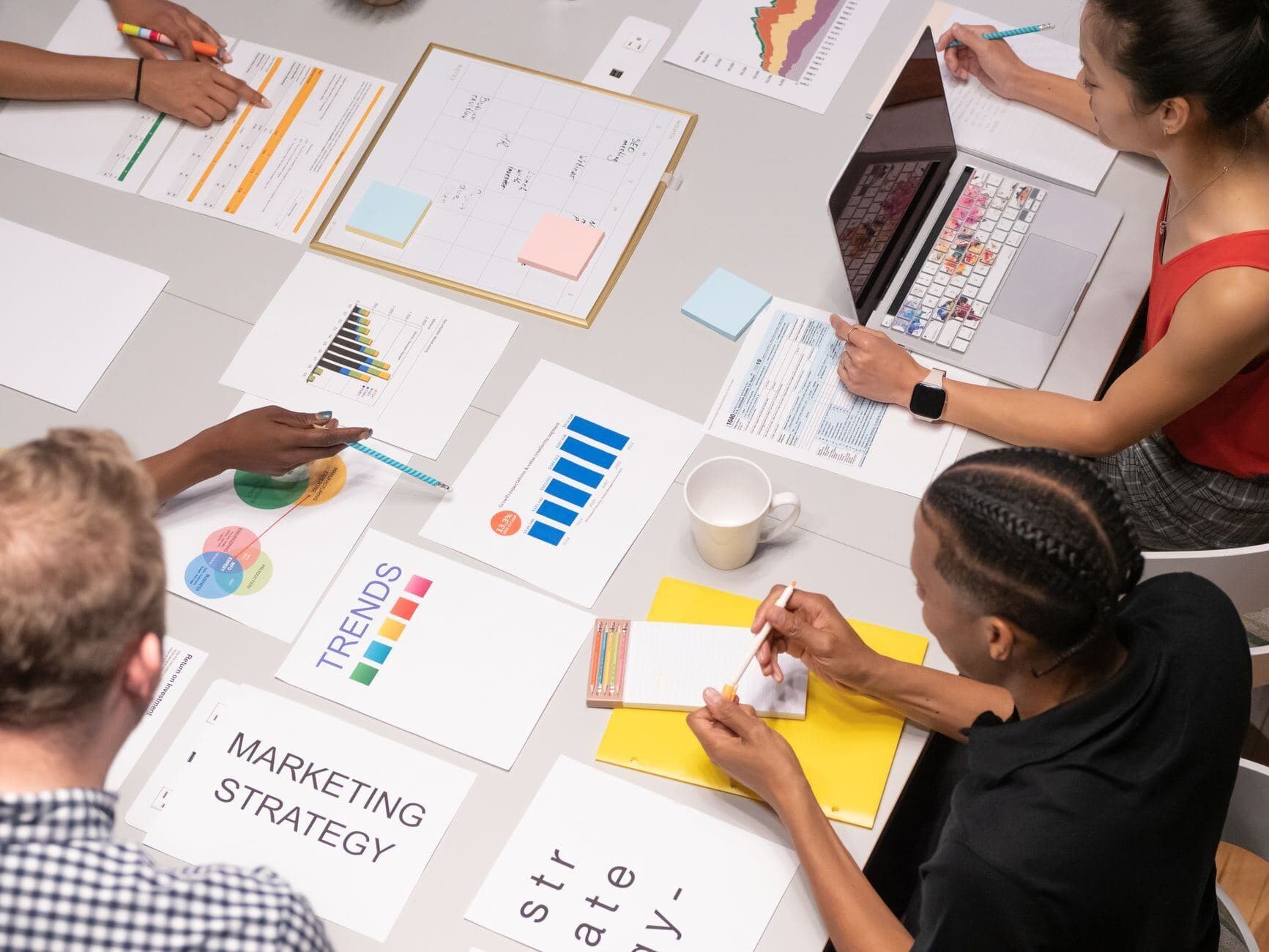 Team planning a campaign at a table