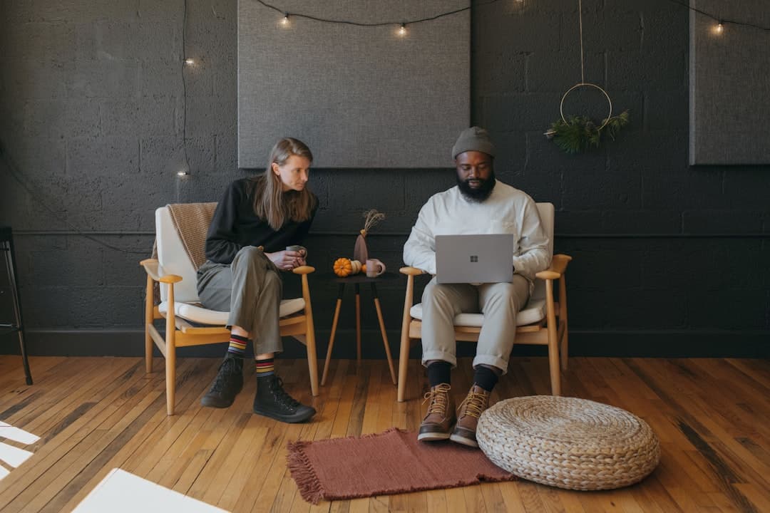 Reviewing Pinterest work together at a laptop, the judgment half of the job