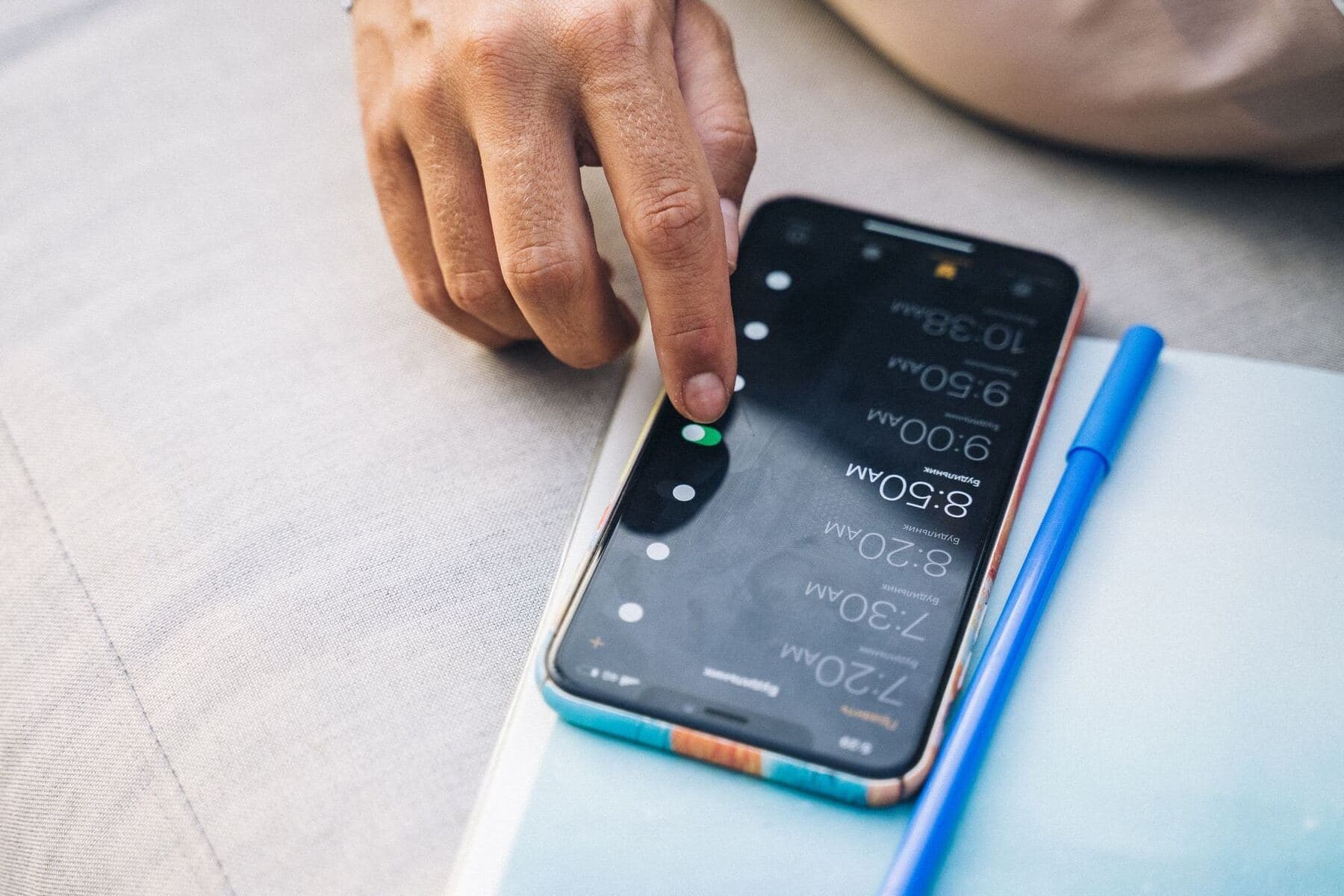 Person scheduling posts on a phone