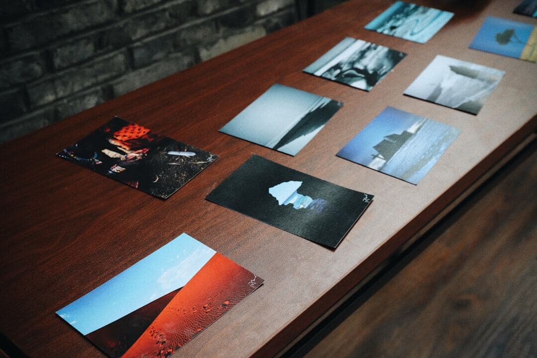 Stack of printed photographs representing a finite creative inventory