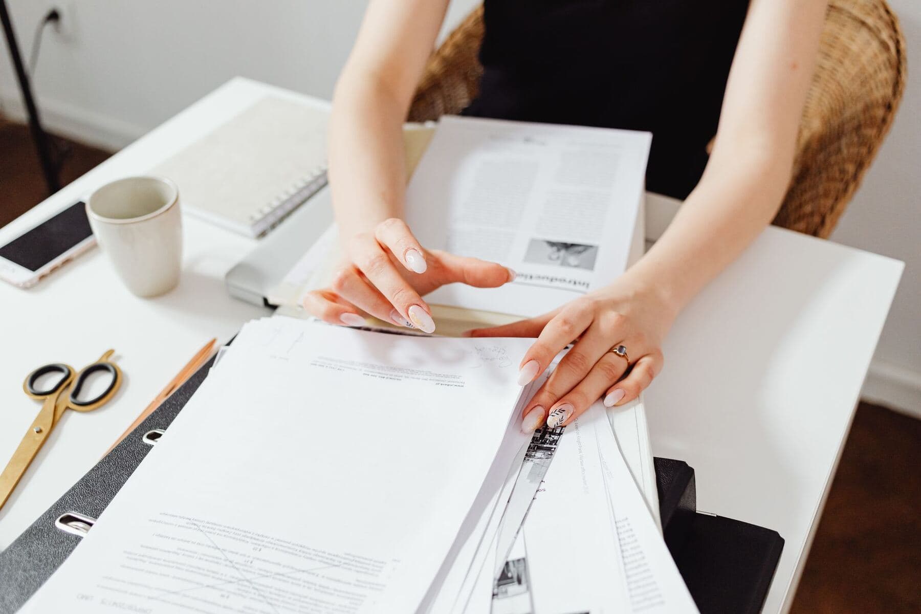 Hands sorting through papers