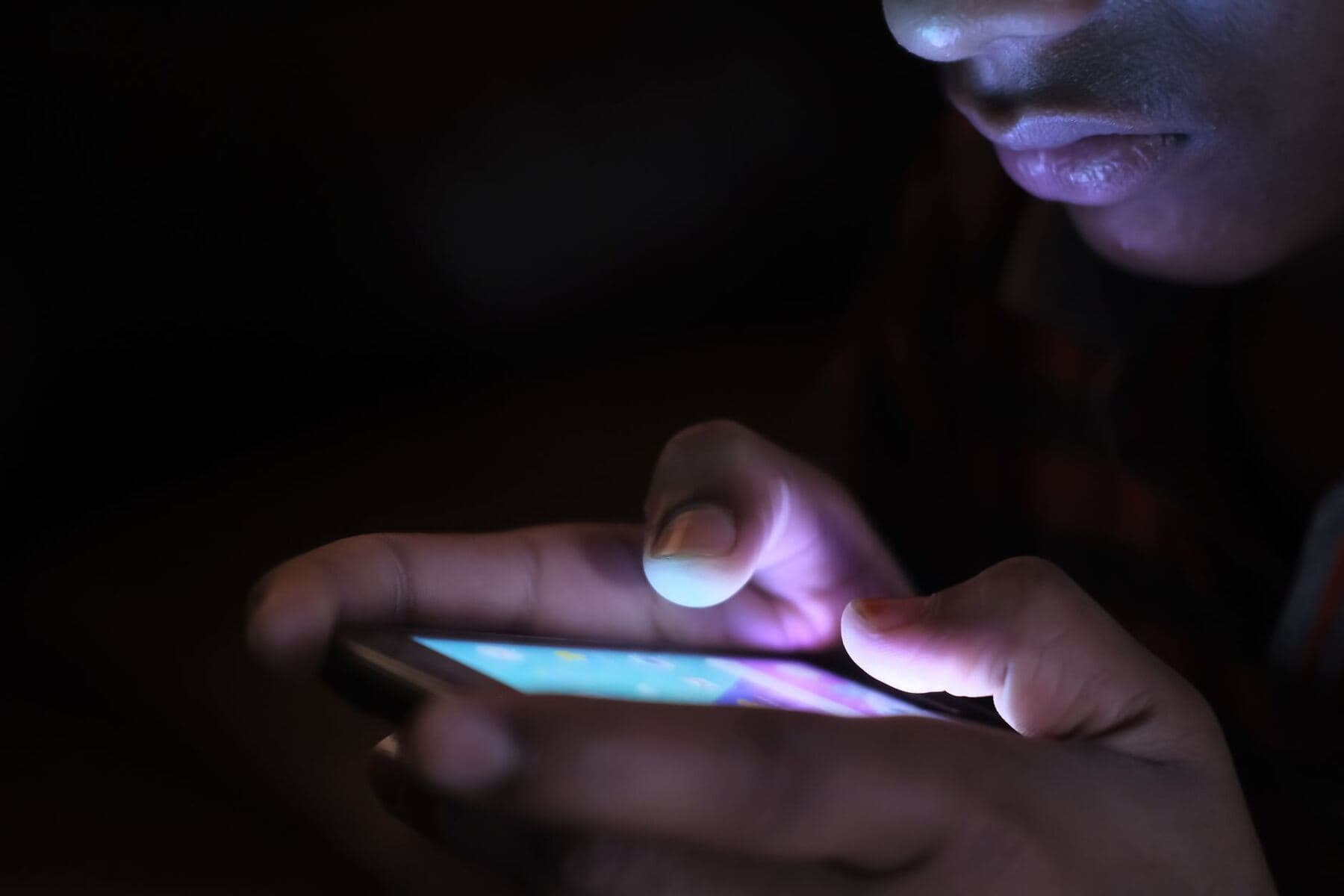 Person using a phone at night