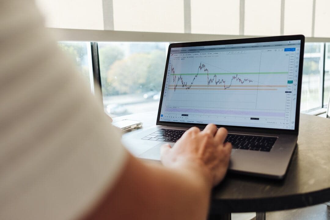 Declining performance chart on a laptop screen
