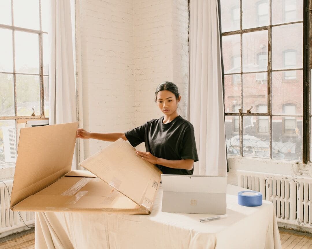 Small business owner packing customer orders